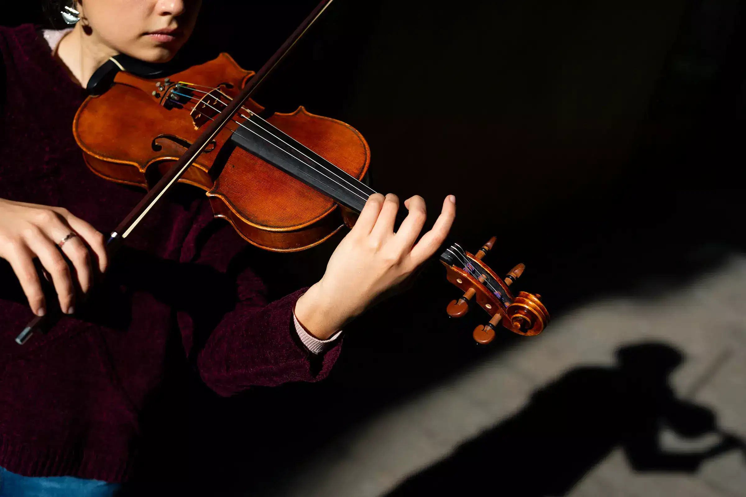 a girl holding a violin